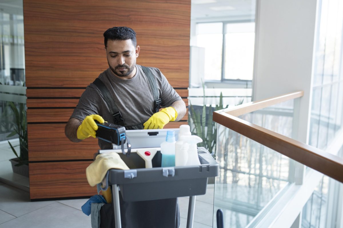shot-man-walking-with-cleaning-cart (1)